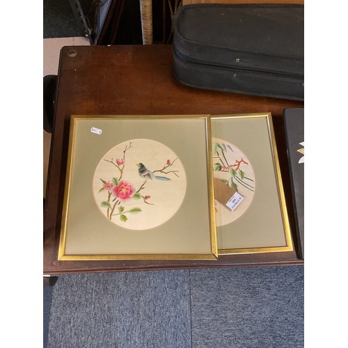 494 - A pair of framed Oriental silks of birds