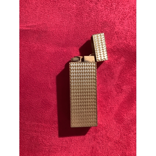 164 - A gold plated Cartier lighter in working order No 1B07376