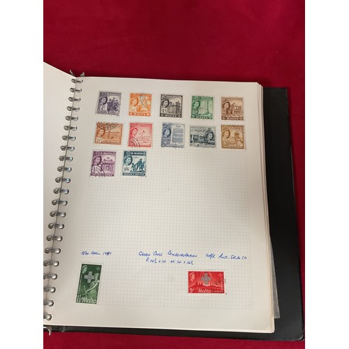 114 - An album housing a collection of hundreds of Malta stamps