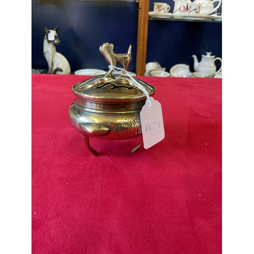 139 - A vintage brass censer engraved with cranes, trees etc the lid mounted with a lion