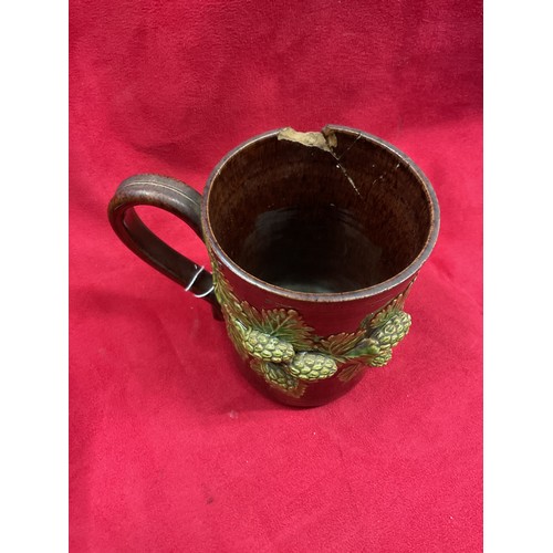 36 - A Rye Pottery brown glazed tankard, vase and bowl with applied hop and vine decoration all for resto... 