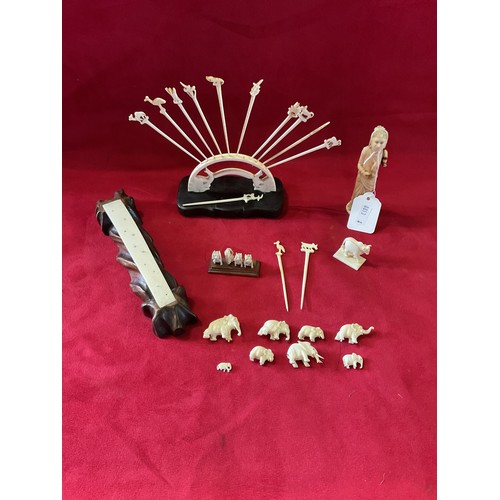 65 - A mixed selection of assorted Oriental bone items to include a figurine, tooth picks, elephants on b... 