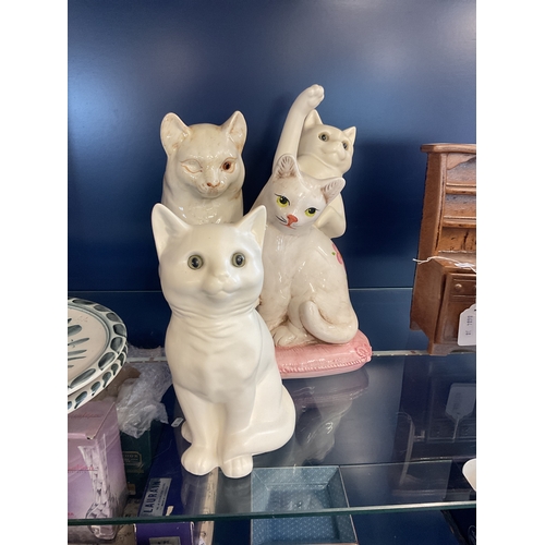 78 - Four assorted ceramic cats