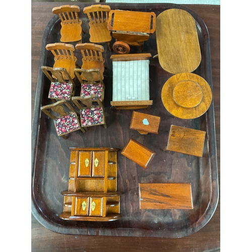 108 - A mixed selection of assorted dolls house furniture to include tables, chairs, dresser etc