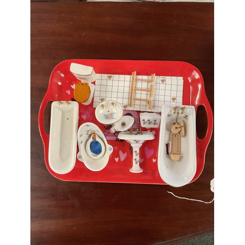 110 - A mixed selection of bathroom related dolls house furniture