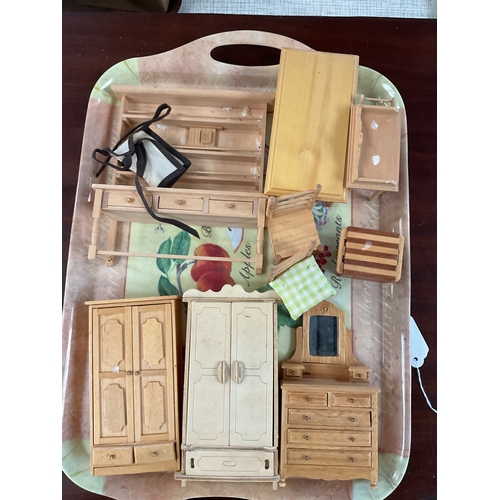 111 - A mixed selection of dolls house furniture to include wardrobes, dresser, table and chairs etc