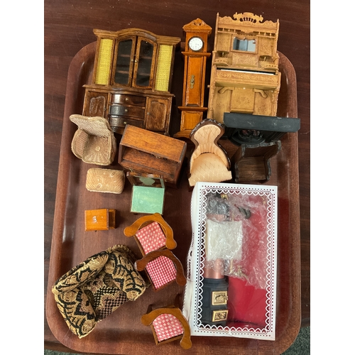 113 - A mixed selection of assorted dolls house furniture to include dresser, long case clock, chairs etc