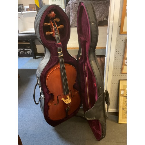 A half size Delux cello with an attractive wood grain back and ribs ...