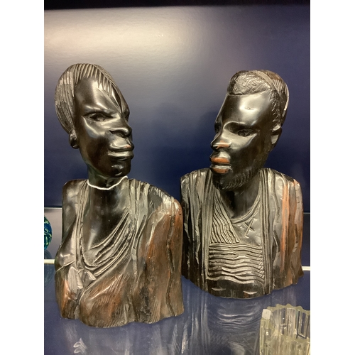 63 - A pair of male and female carved ebony African heads
