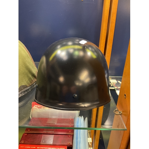 100 - A black painted French’s helmet