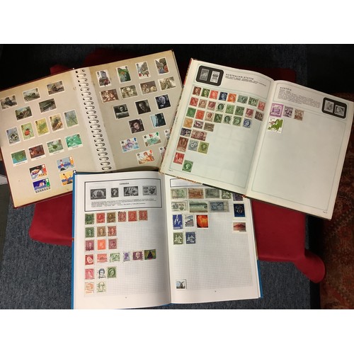 112 - Three albums housing a mixed selection of stamps if the World to include Great Britain, Hungary, Ind... 