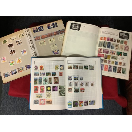 112 - Three albums housing a mixed selection of stamps if the World to include Great Britain, Hungary, Ind... 