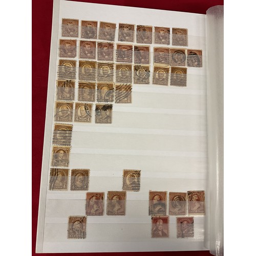 117 - An album of USA stamps to include Franklin one cent, two cent, Oliver Wendell Holme, Kennedy, Roosev... 