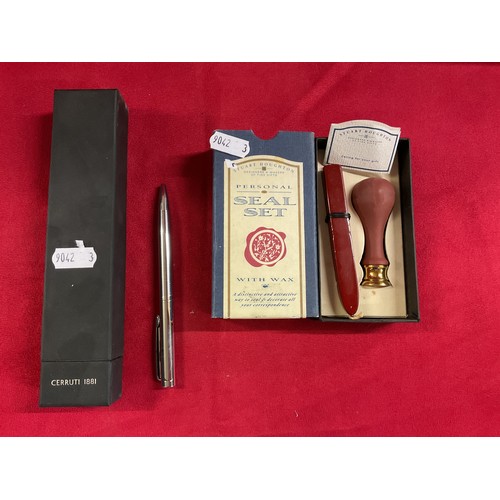 184 - A boxed Cerruti ballpoint pen and a personal seal set