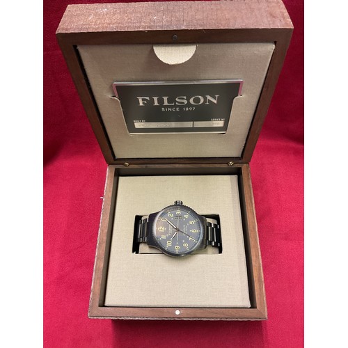 218 - A box as new Filson stainless steel wristwatch the dial having date aperture with certificate, fitte... 