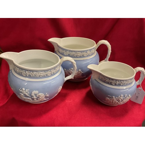 28 - Three vintage Cheetham Woolley graduating pitcher jugs