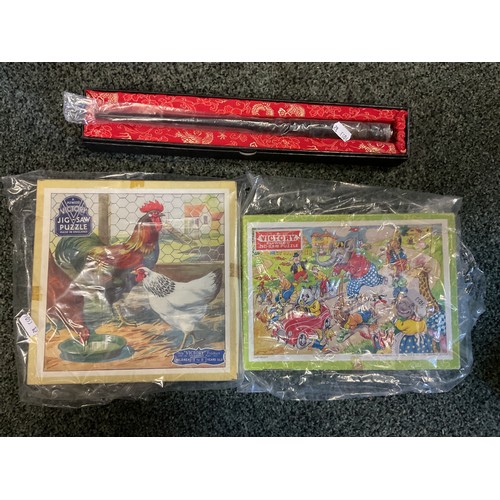 324 - A boxed wand and two children's jig-saw puzzles