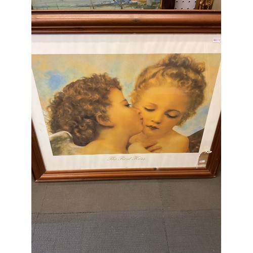 354 - A framed and glazed poster 'The First Kiss'