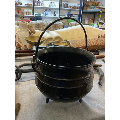 A black iron cauldron standing on three feet