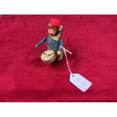 147 - A vintage 1930's clockwork Schuco drummer boy in blue top and green trouser with red hat