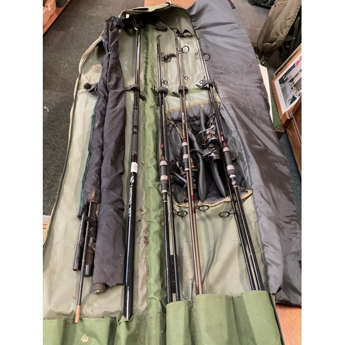 A TF Gear rod bag with four rods, reels, landing net and pole