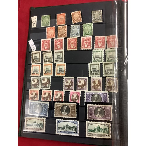 349 - An album housing a selection of mint and used stamps from the Vatican dated from 1933