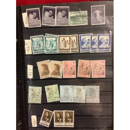 349 - An album housing a selection of mint and used stamps from the Vatican dated from 1933