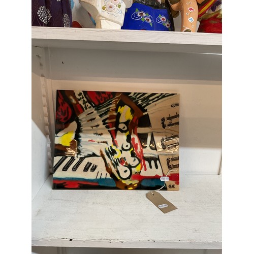 333 - An abstract ceramic tile with piano decoration, signed Quarn