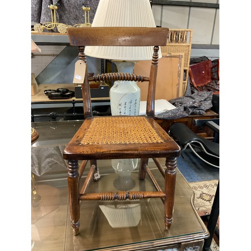 337 - A vintage child's correction chair with bergere seat