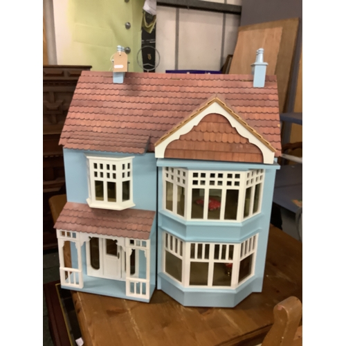 341 - A vintage dolls house with converted attic space and some furnishings