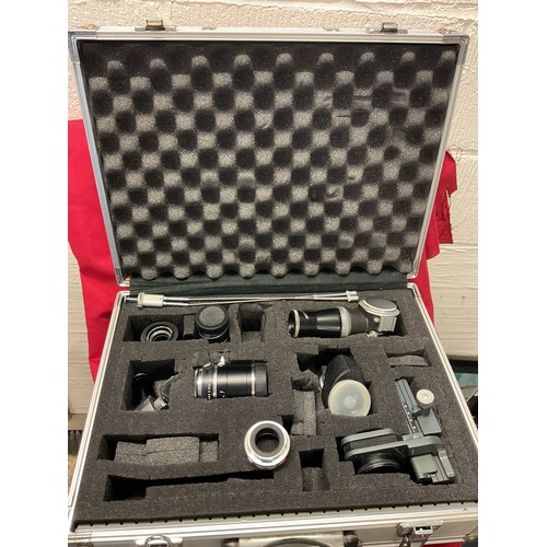89 - A camera hard case and Leitz camera accessories