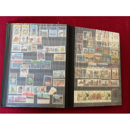 289 - An album housing a large collection of New Zealand stamps