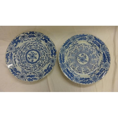 264 - Pair C18th? Chinese Blue & White Chargers, central flower surrounded by 12 segments of flowers & lea... 