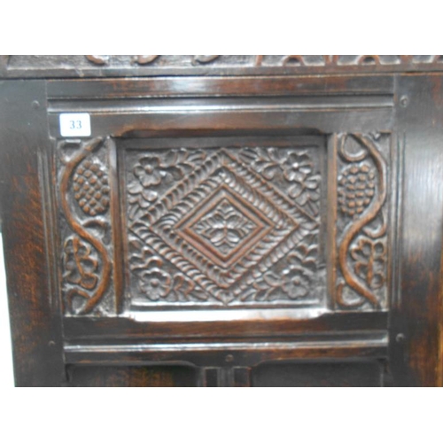 33 - C18th Oak Cabinet with 8 panelled doors to the front & carved 'CDD 1720' above, each side set with n... 