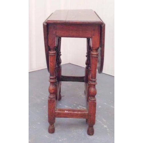 39 - C18th Oak Drop Flap Gate Legged Table on turned supports