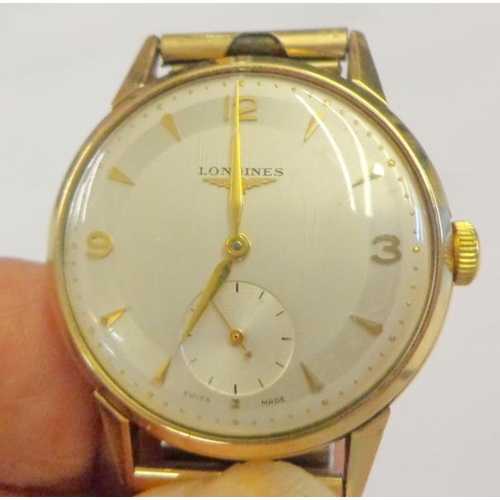 209 - 9ct Gold Transitional Baume Longines Gents Wristwatch 9ct gold case, white dial with gilt baton & qu... 