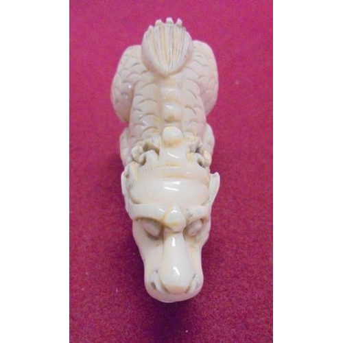 279 - Carved Ivory Netsuke Howling Dog of Fo, signed to foot