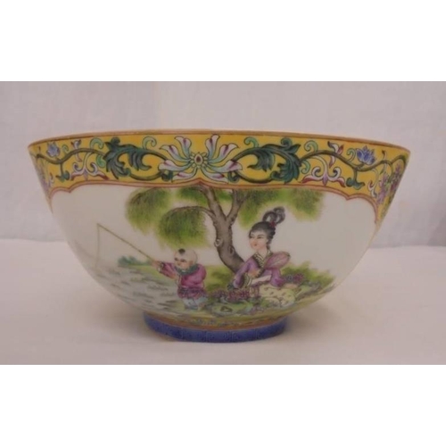 283 - C20th Chinese Bowl with yellow ground, panels Famille rose enamels, young boy fishing with lady atte... 