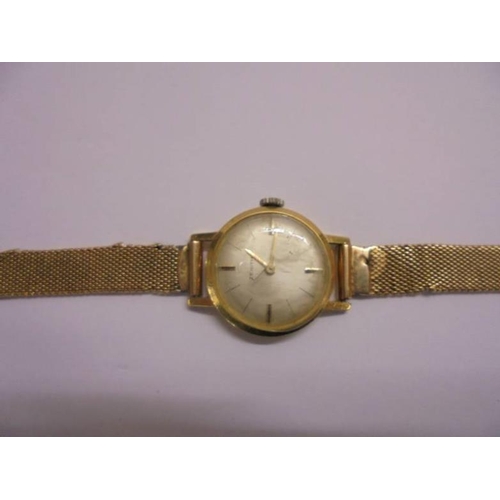 308 - Ladies 18ct Gold Zenith Wristwatch with 18ct gold, silvered dial with baton markers