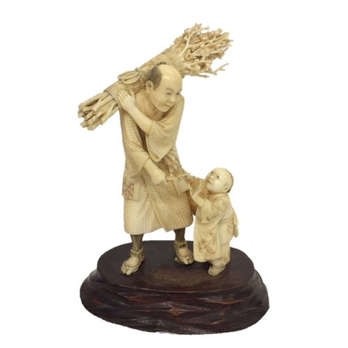 260 - Chinese Okimono Figural Group with young child wood collector with basket on his shoulders, on carve... 