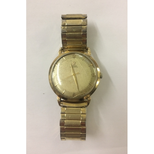 323 - 9ct Gold Omega Automatic with Arab compass numerals & baton markers, sweep second hand, gilt strap