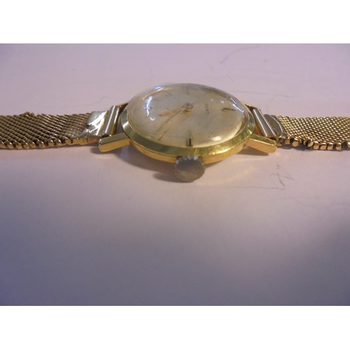 308 - Ladies 18ct Gold Zenith Wristwatch with 18ct gold, silvered dial with baton markers