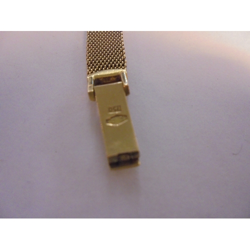 308 - Ladies 18ct Gold Zenith Wristwatch with 18ct gold, silvered dial with baton markers