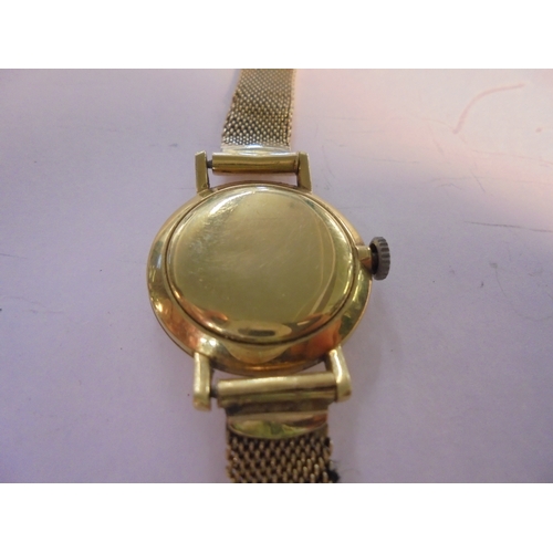 308 - Ladies 18ct Gold Zenith Wristwatch with 18ct gold, silvered dial with baton markers