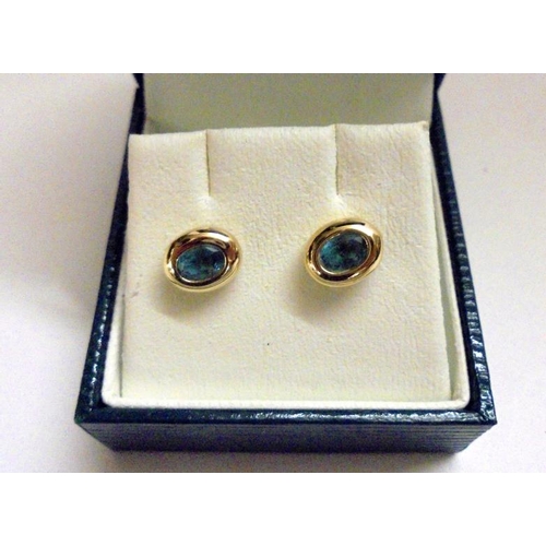 526 - Pair 9ct Gold Ladies Blue Topaz Set Earrings & Pair Yellow Metal Coiled Style Earrings with screw ba... 