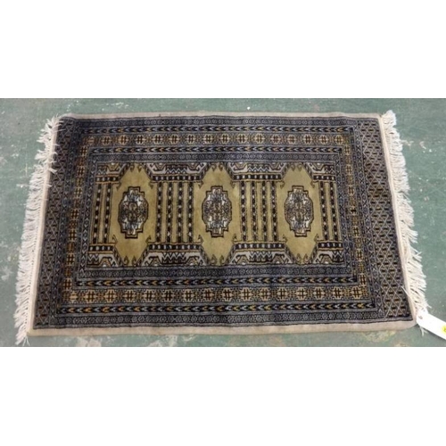 33 - Oriental Rug with plum ground & green centre, approx. 52