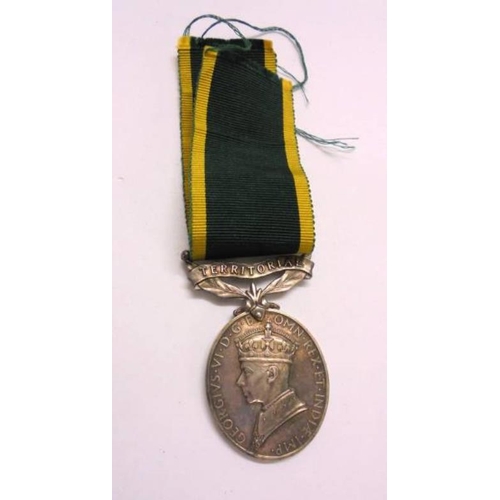 413 - Territorial Army Medal for services awarded to gunner JL Ratchford Royal Artillery with ribbon