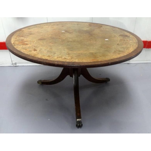 28 - Reproduction Circular Centre Table with inset tooled leather on tripod supports with animal paw cast... 