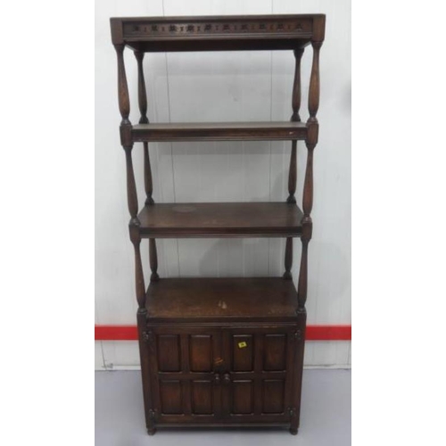 36 - Unusual Oak Side Cabinet with pair 1/4 panelled doors, internal Shelves, carved frieze, on turned su... 