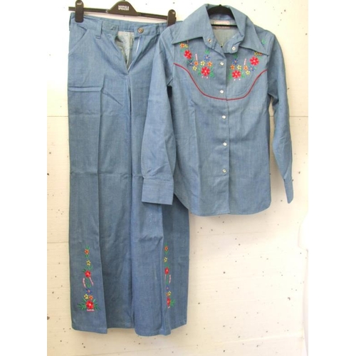 576 - 1970's Blue Denim Trouser Suit with embroidered flowers, labelled size 38